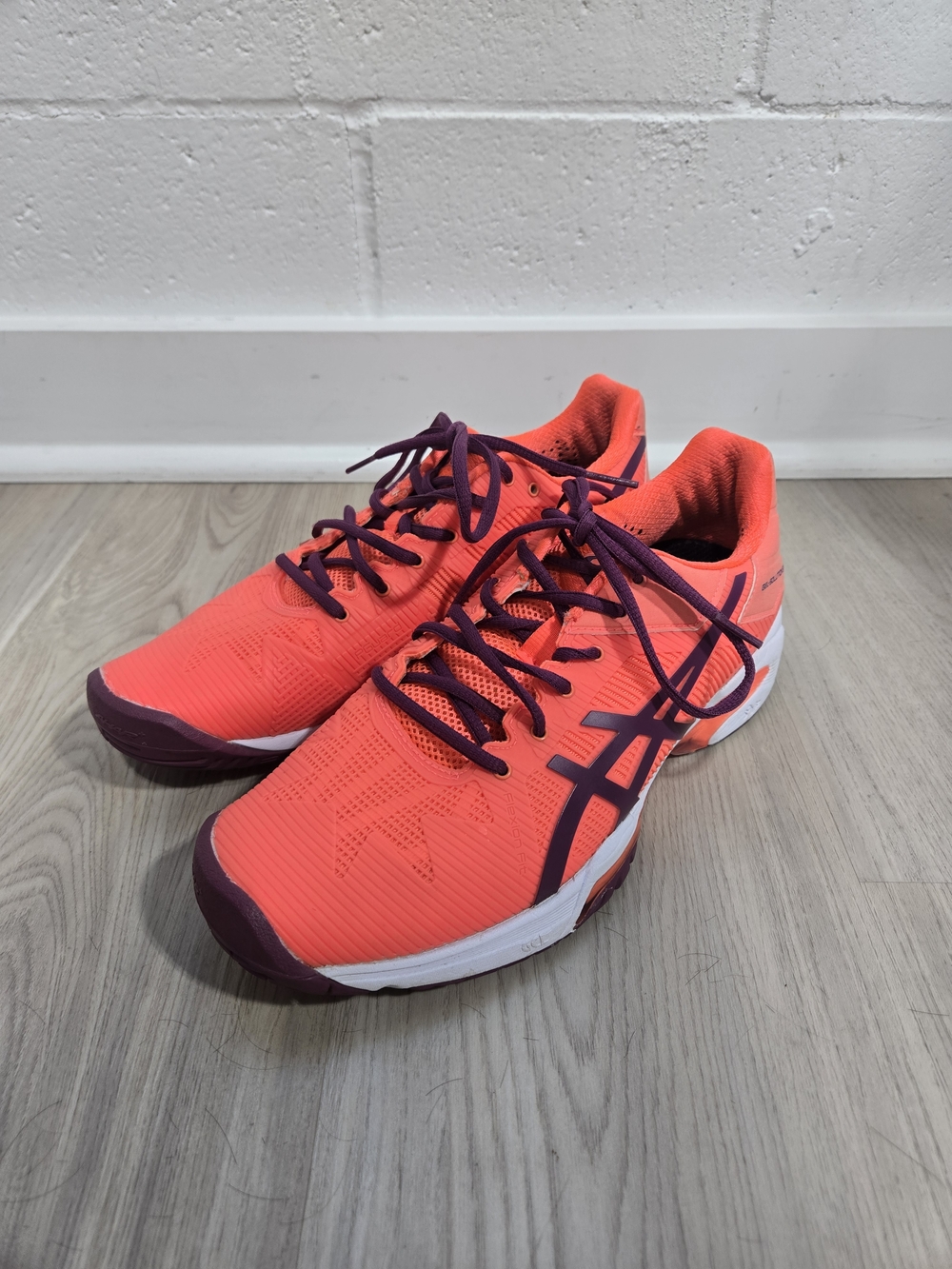 ASICS Neon Coral Athletic Running Shoes with Deep Purple Accents